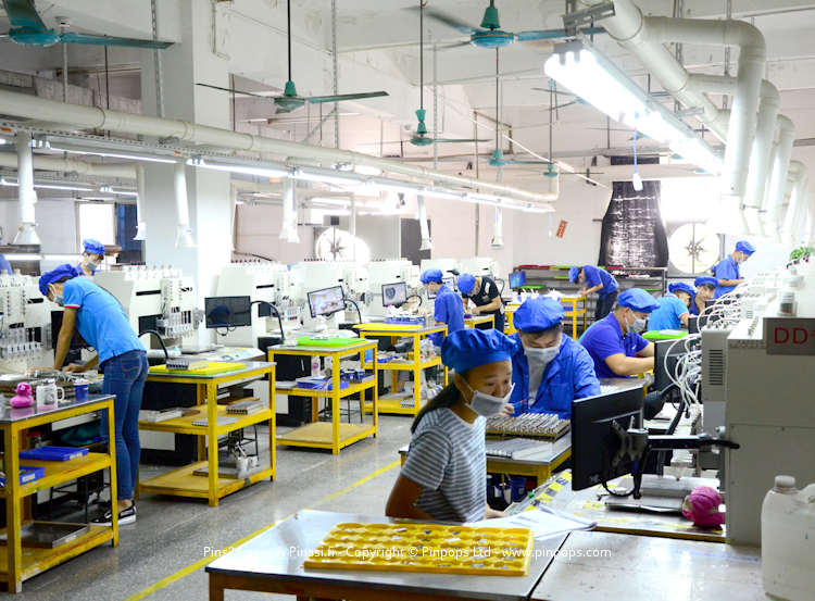 Manufacturing lapel pins in an audited factory