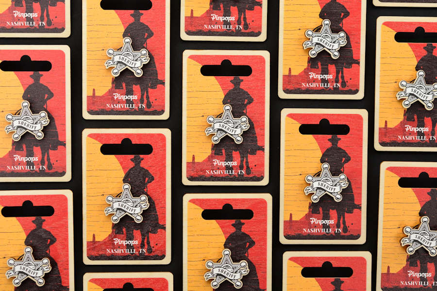 Wooden lapel pins and backer card, Nashville, Tennessee